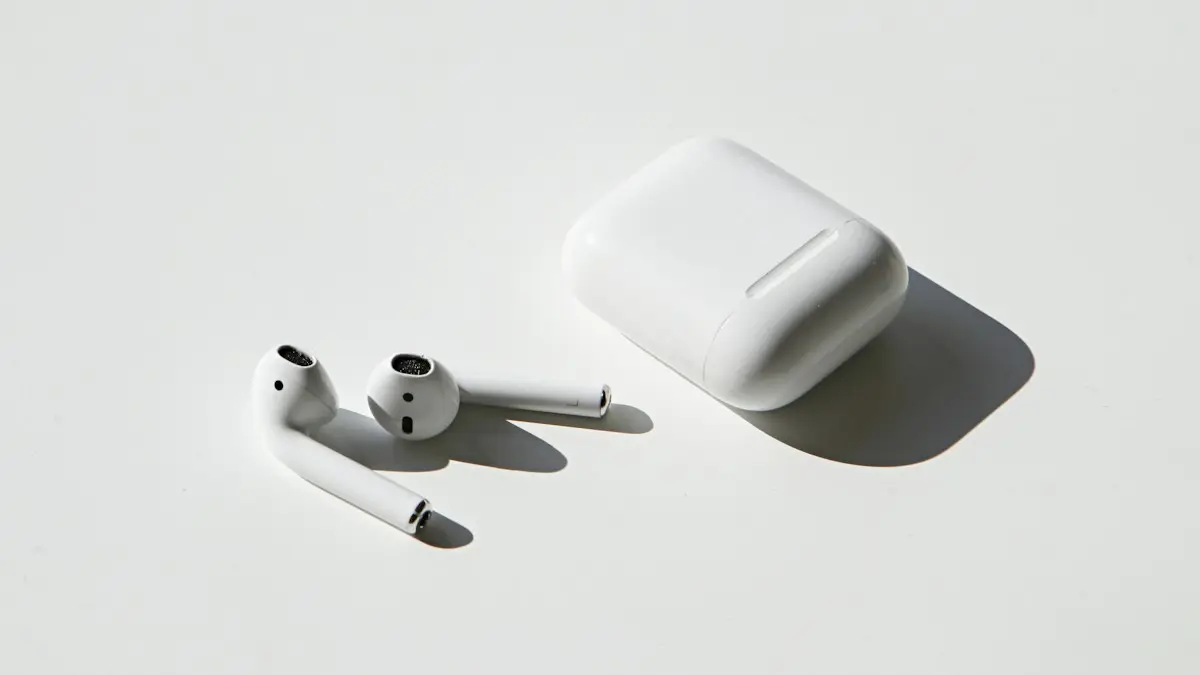 Apple earpods beside apple airpods