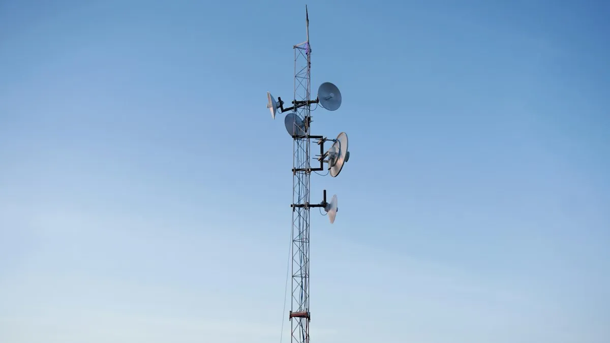 A cell phone tower with three antennas on top