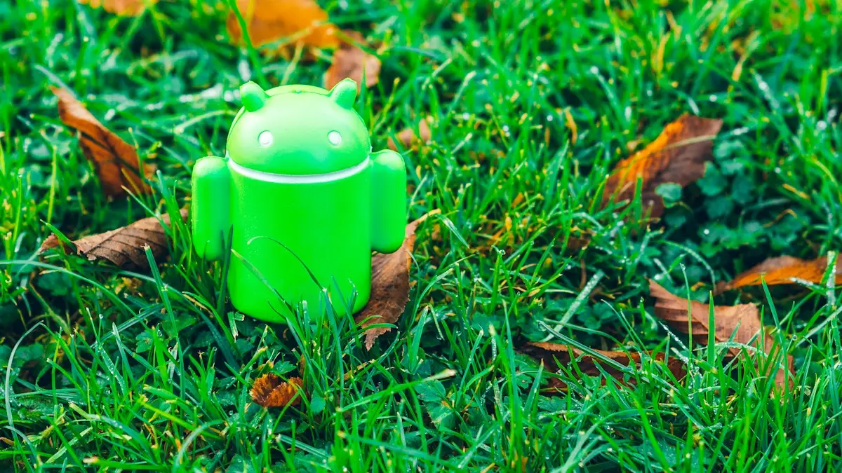Green Android robot toy on grass