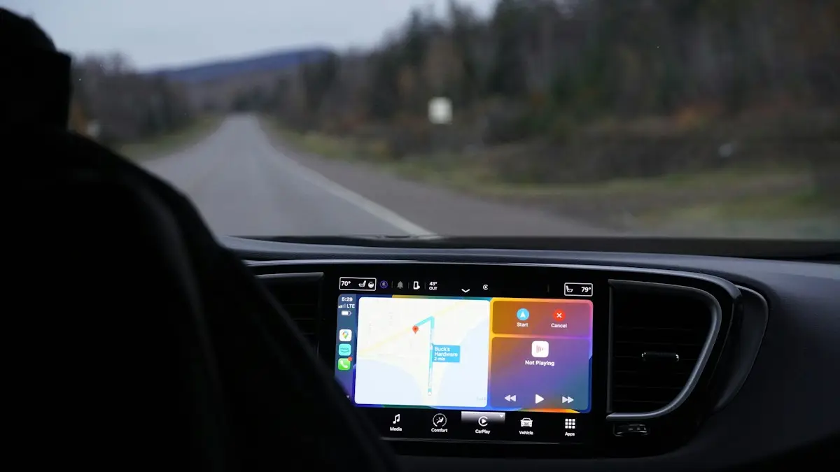 A man driving a car with a gps device in his hand