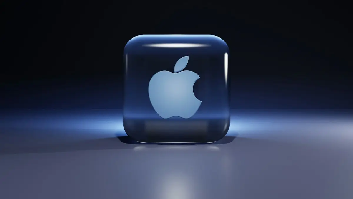 A translucent blue glass cube with an apple logo inside on a surface