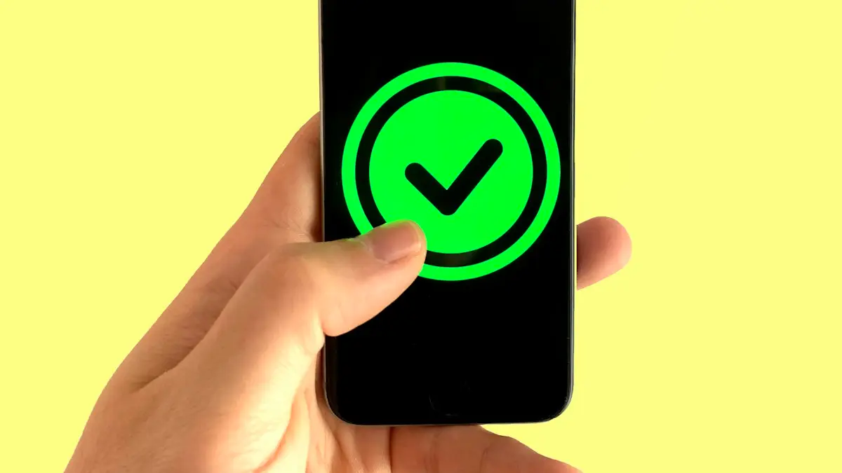 Black android smartphone displaying green and black logo