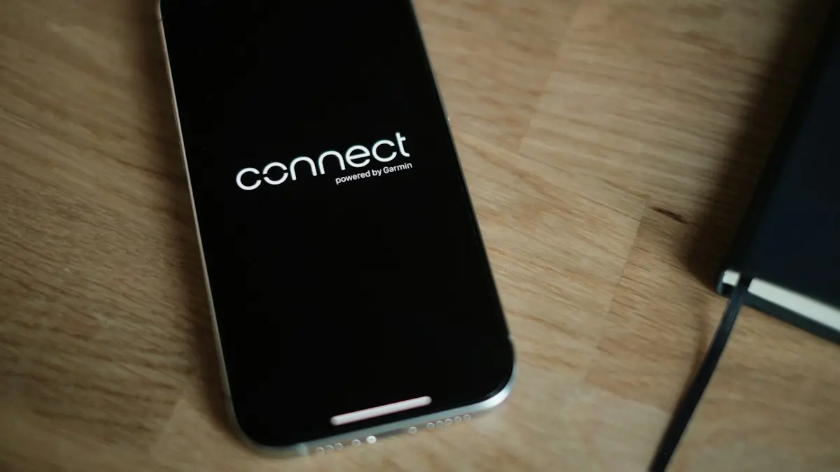 A cell phone sitting on top of a wooden table