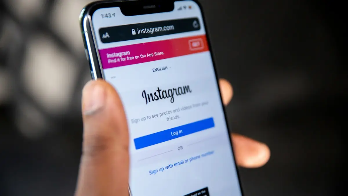 A hand holding a smartphone displaying the Instagram login page on a screen