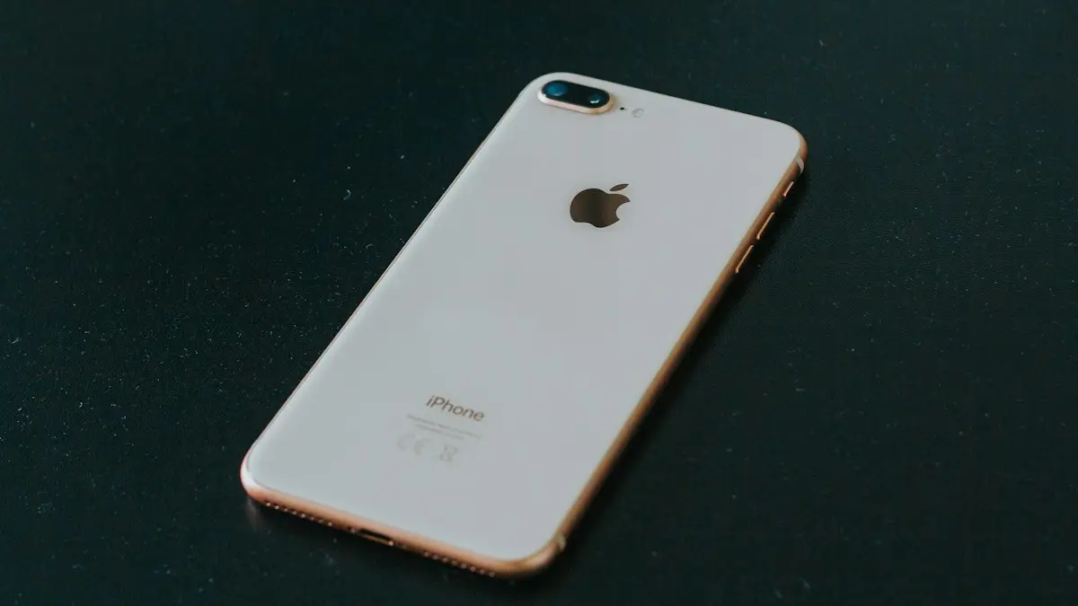 Gold iPhone 7 Plus on black surface