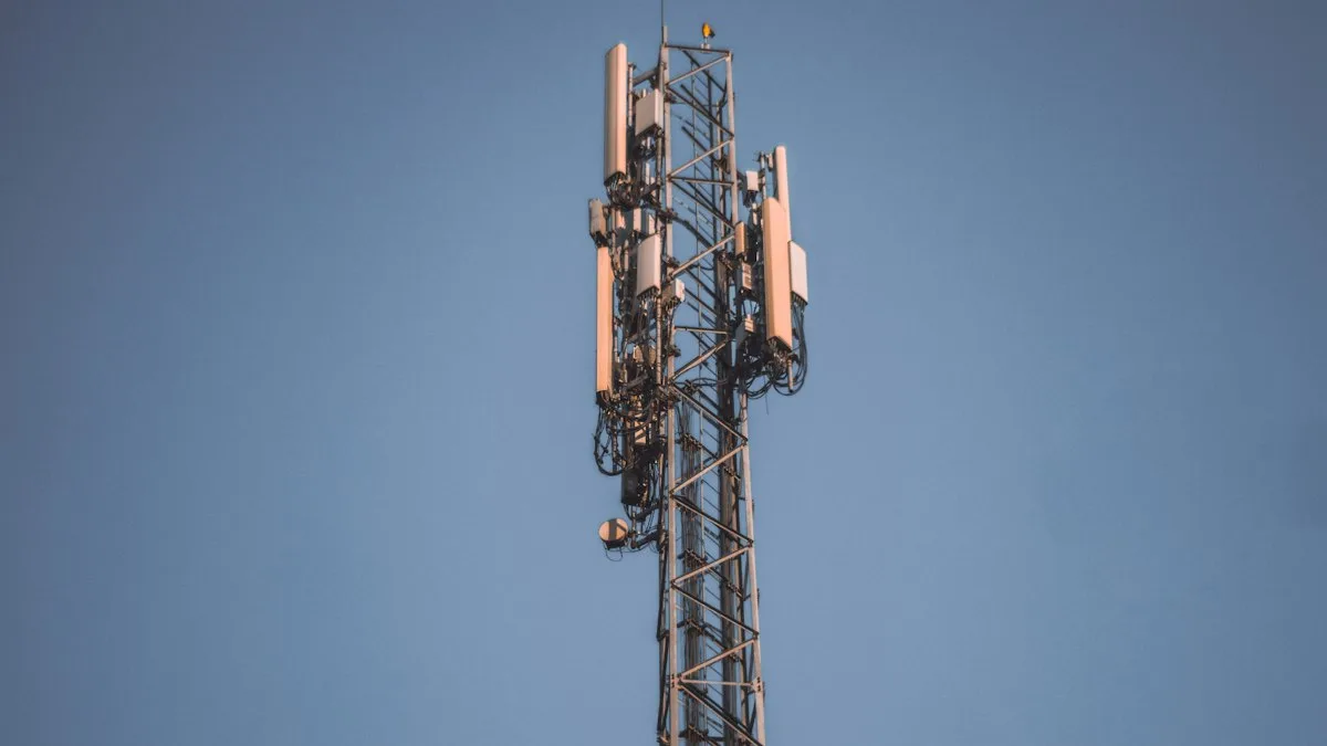 A cellular tower against a clear blue sky