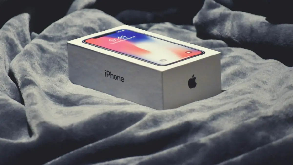 Space gray iPhone X box on gray textile