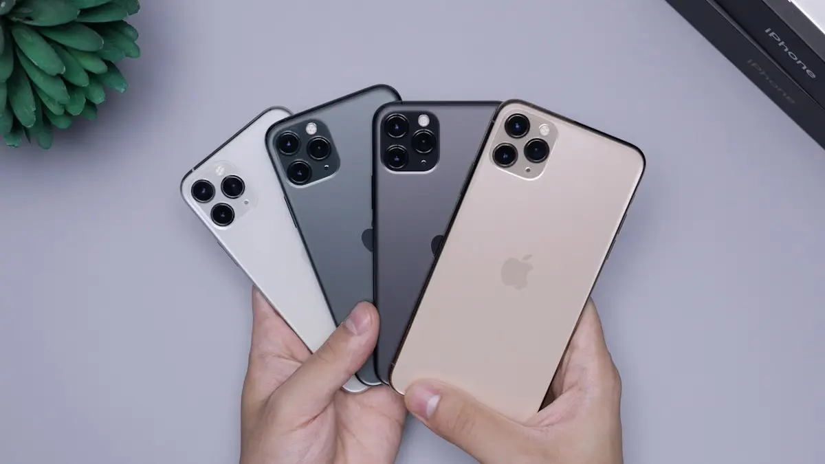 Two space gray and two silver iPhone 11's