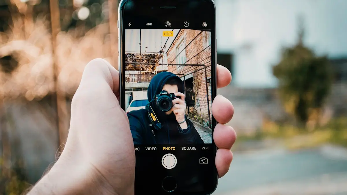 Person holding black iphone 4