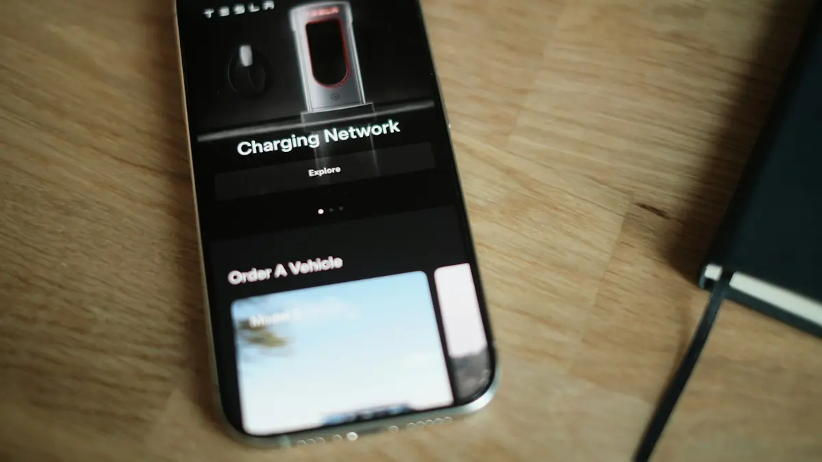A cell phone sitting on top of a wooden table
