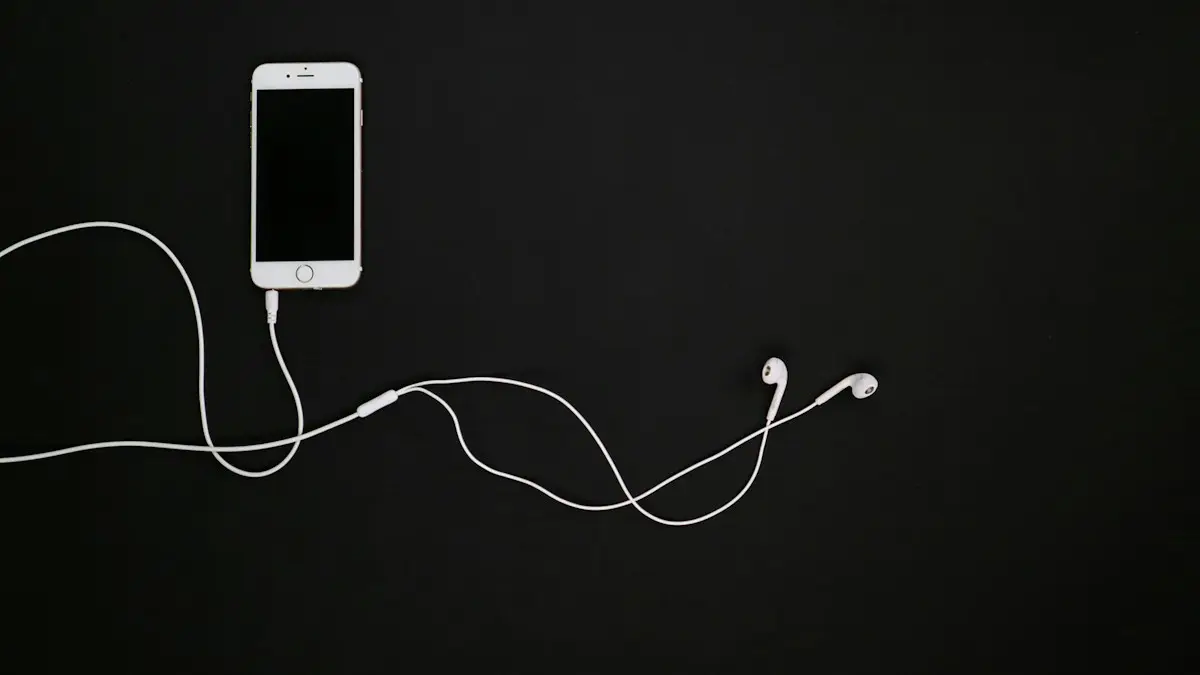 White iphone 5 c beside white earbuds