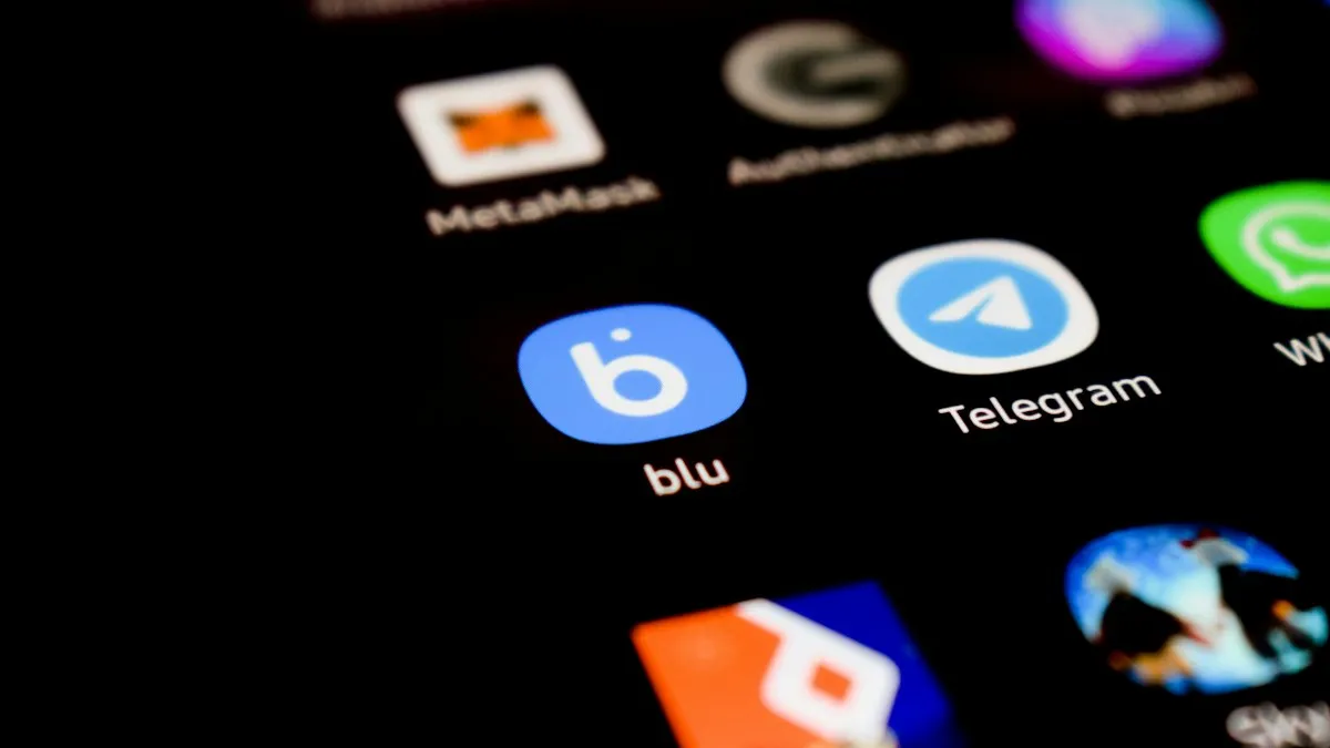 A close up of a phone with different app icons