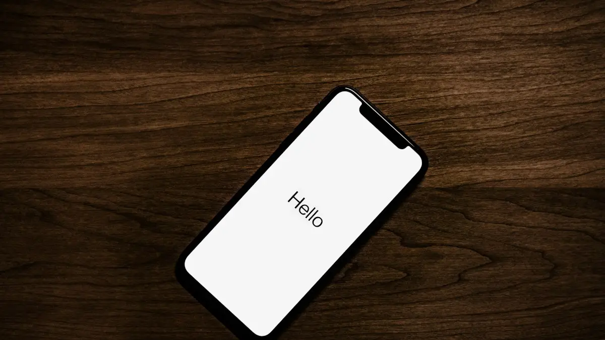 Turned on iPhone on top of brown wooden surface