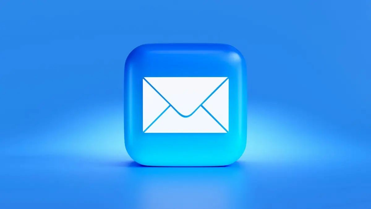 A blue button with a white envelope on it