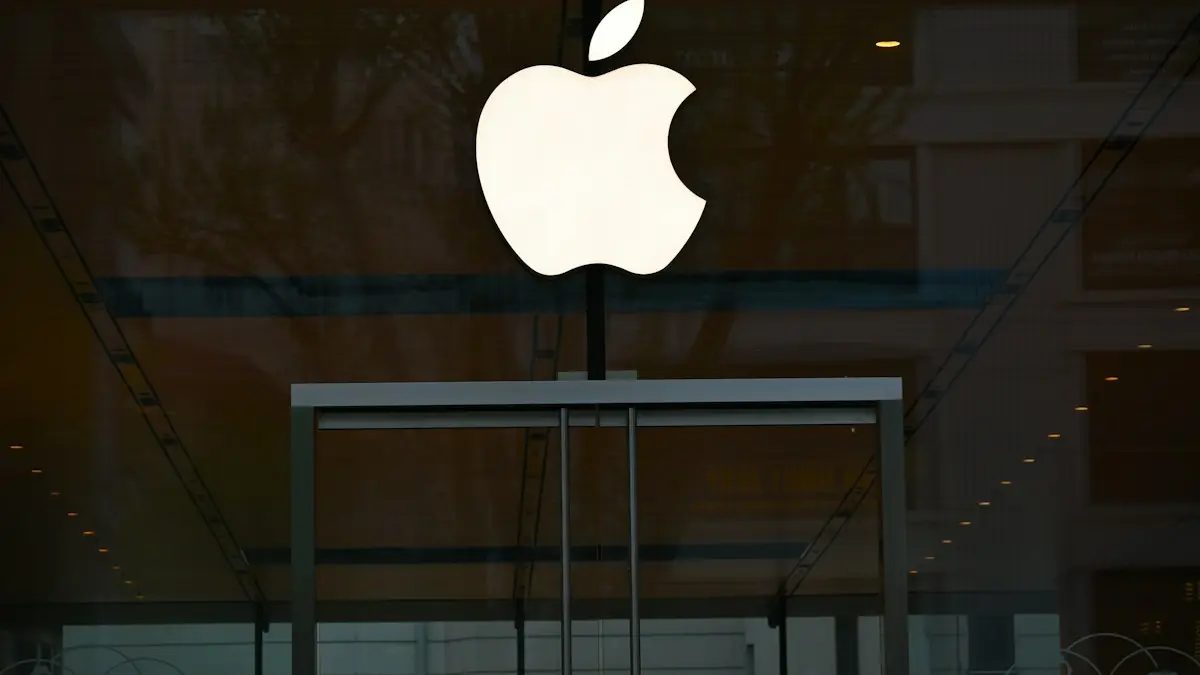 The apple logo is reflected in the glass of a building