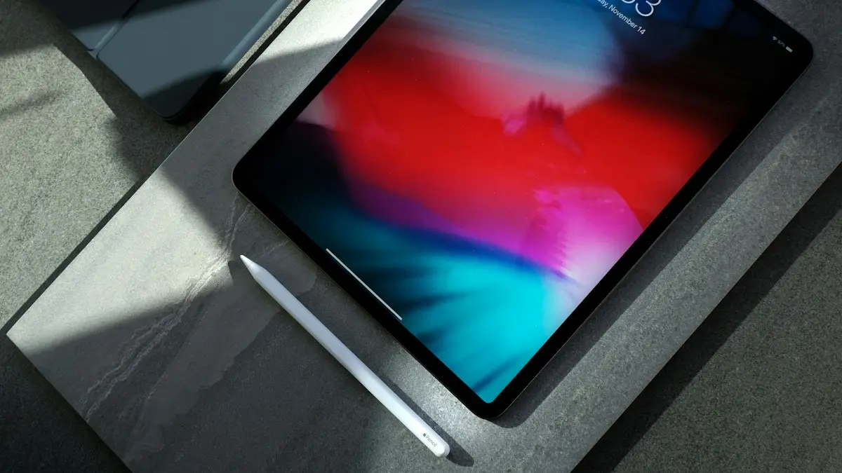Black iPad with white stylus pen
