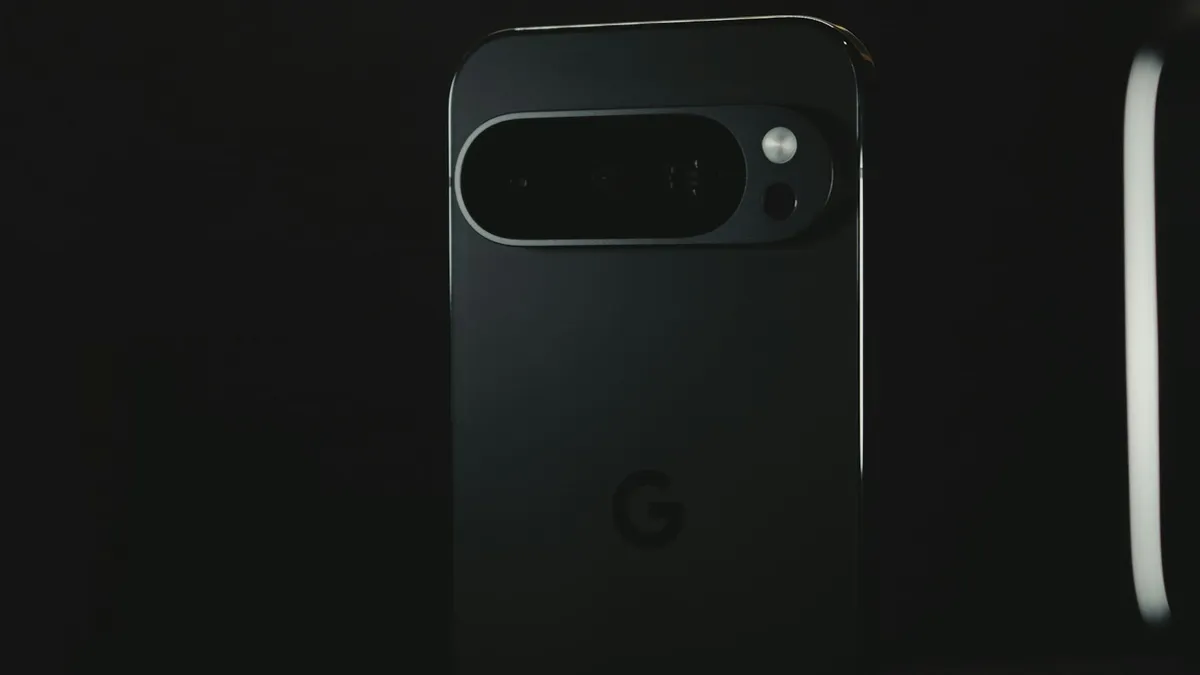 The back of a black Pixel phone against a dark background