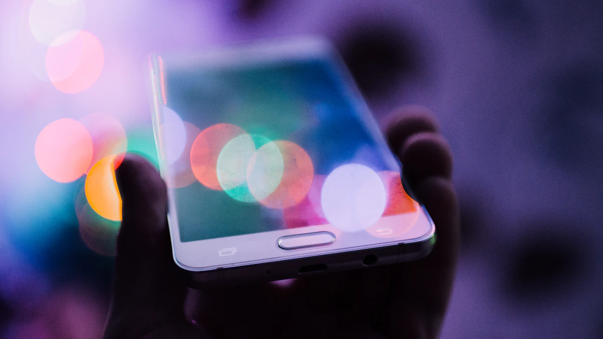 A hand holding a phone with colorful lights behind it
