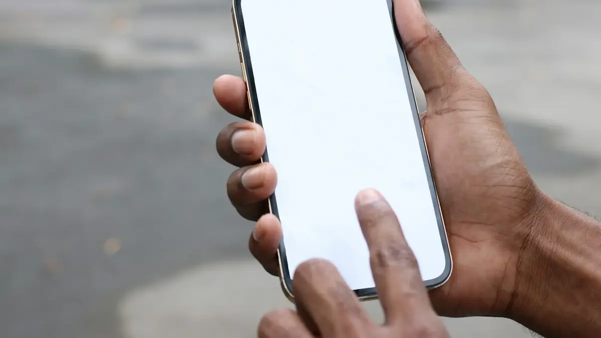 Person holding silver iphone 6 with black case