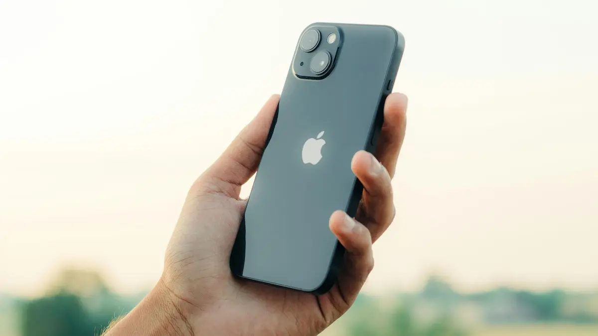 A person holding an iphone in their hand