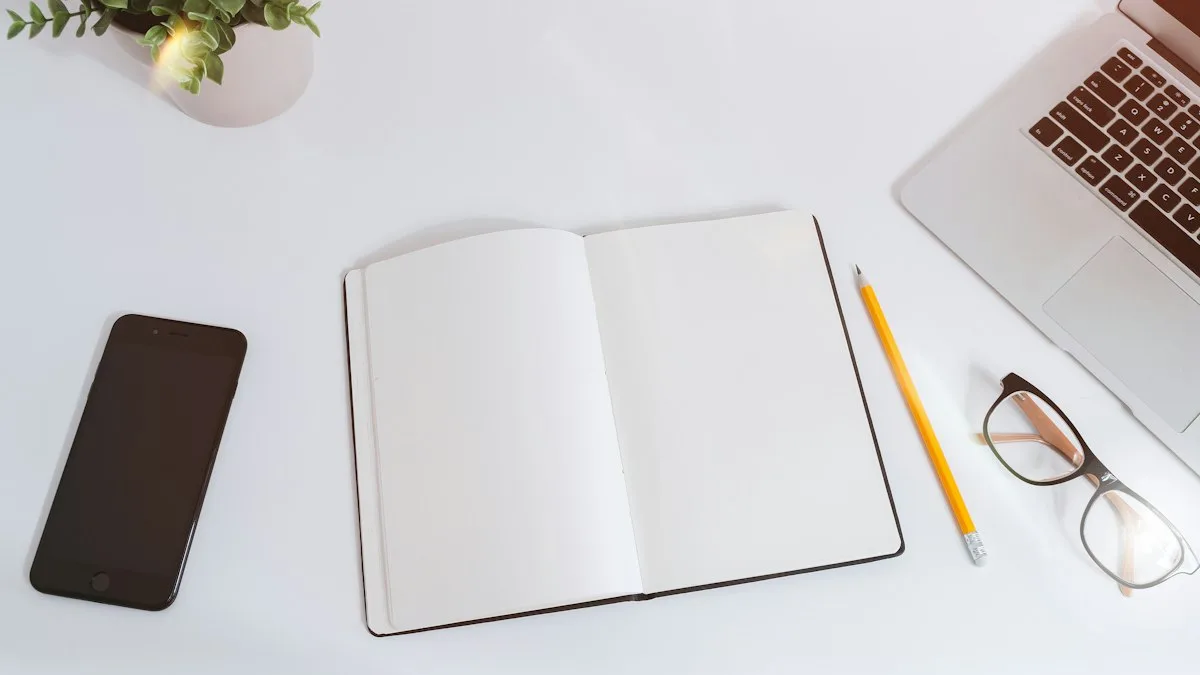 An iPhone and a MacBook on a white desk
