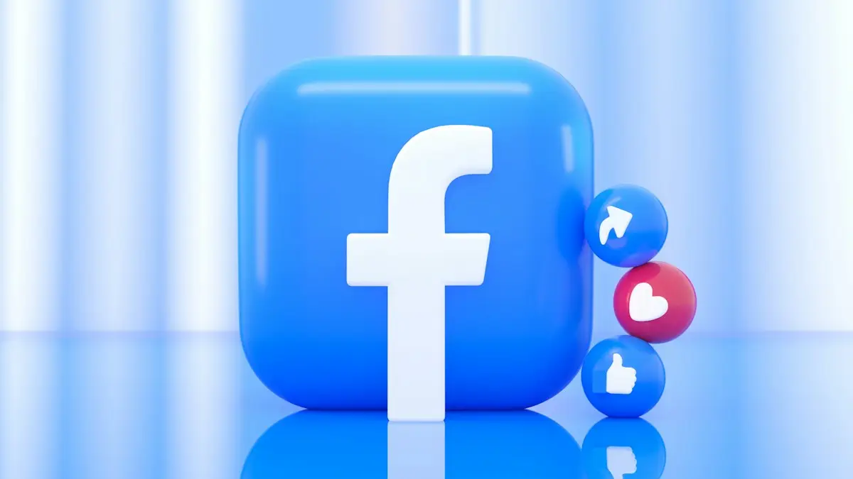A blue Facebook logo icon with small share, like, and heart reaction spheres