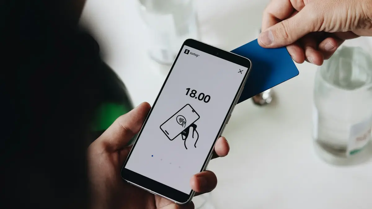 A person holding a cell phone in their hand