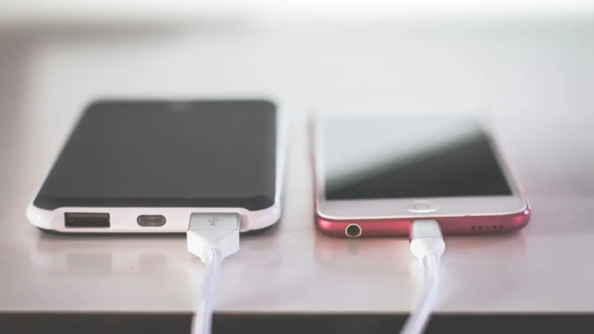 Two phones on white table
