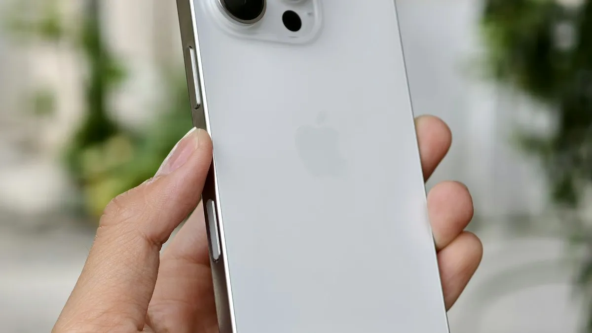 A person holding a white iPhone