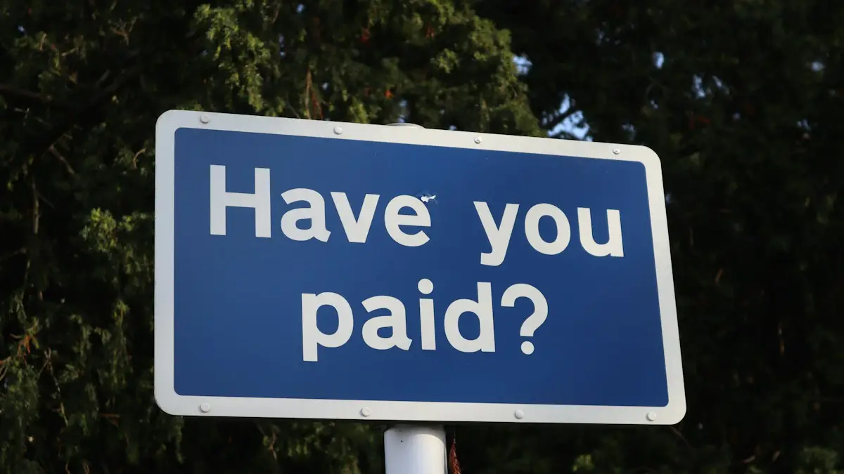 A blue sign that says have you paid?