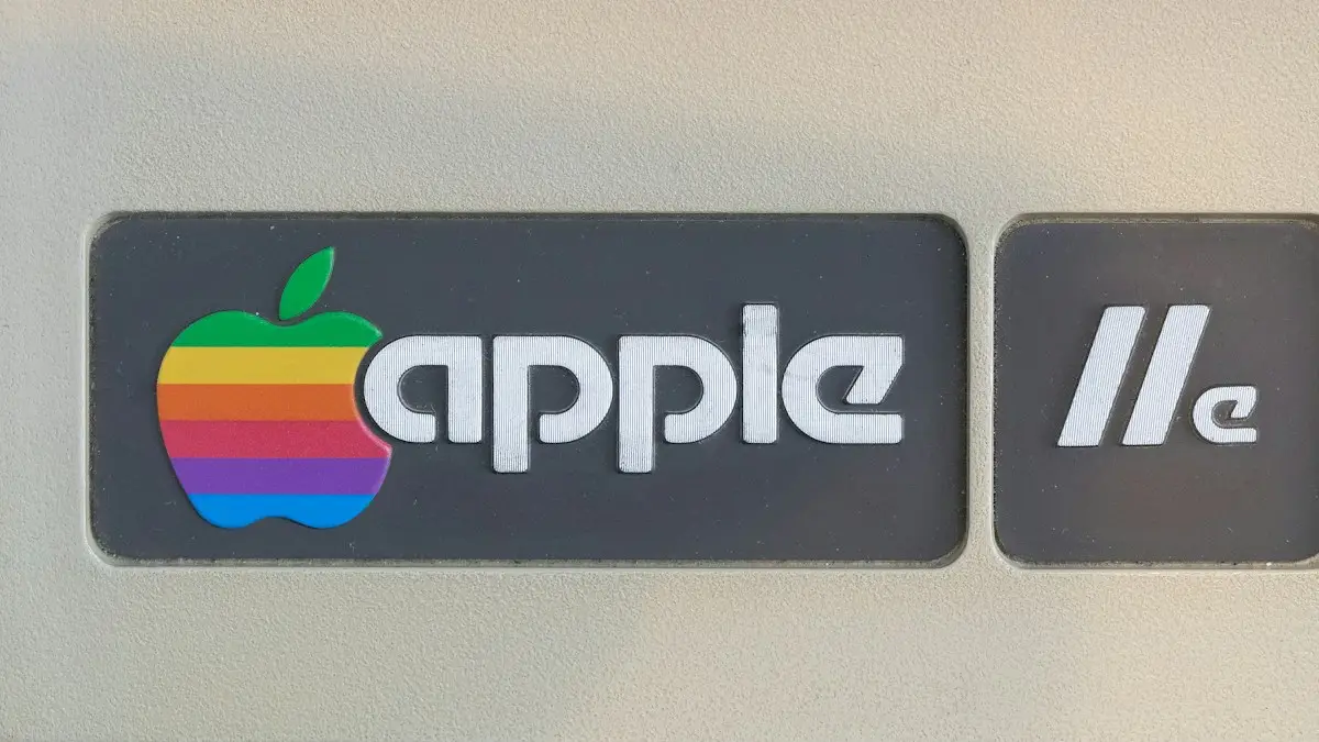 A close up of a sign with an apple logo