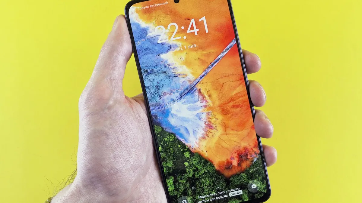 A person holding a Samsung phone in their hand