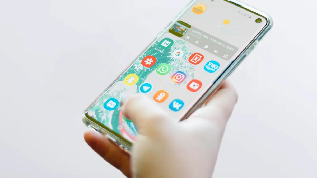 Person using silver Android smartphone