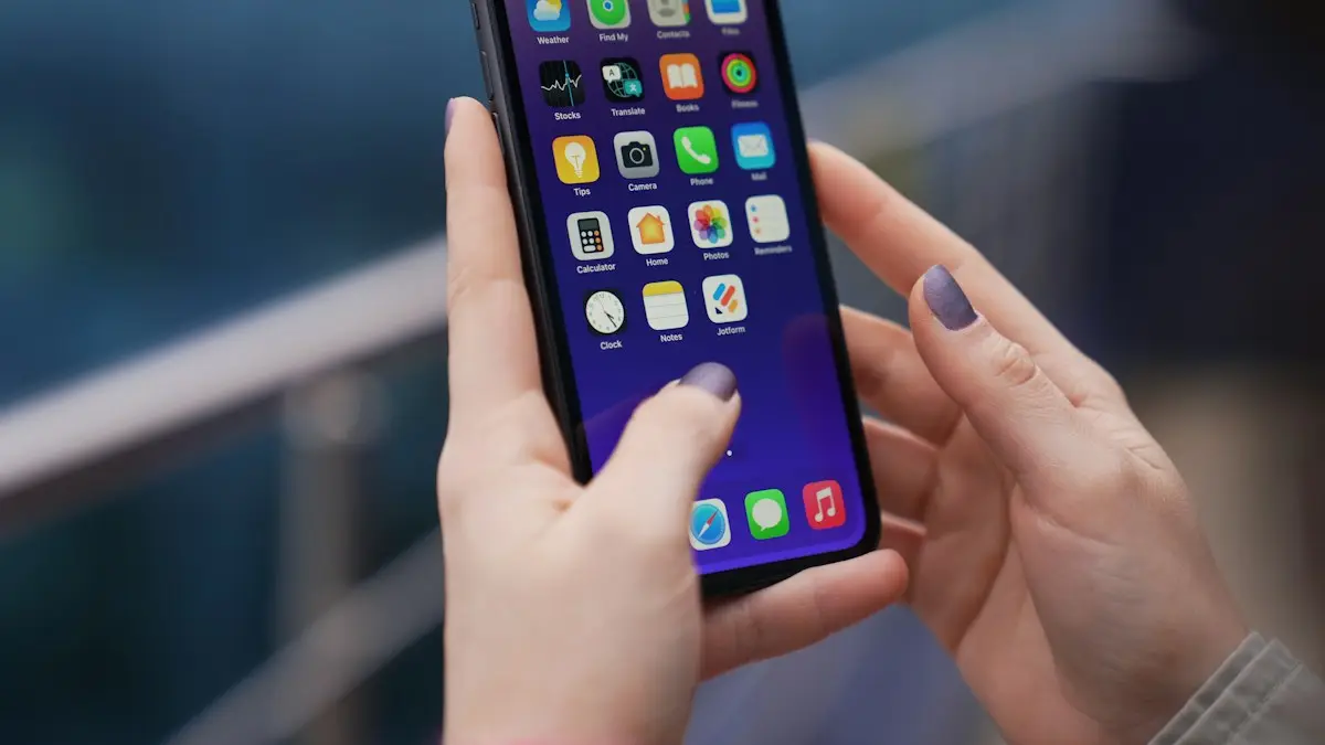 A woman holding a cell phone in her hands
