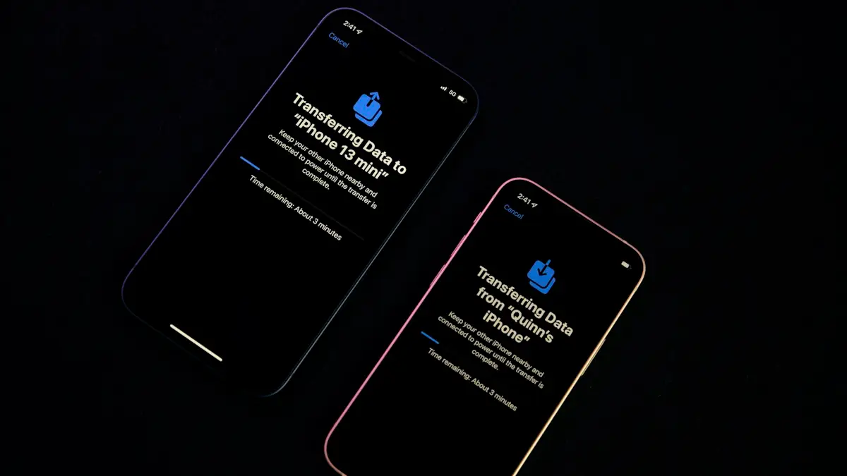 Two iphones sitting next to each other on a table