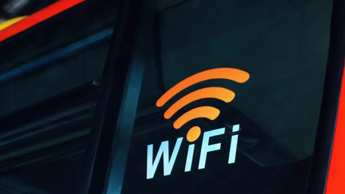 A close up of the wifi logo on the side of a bus