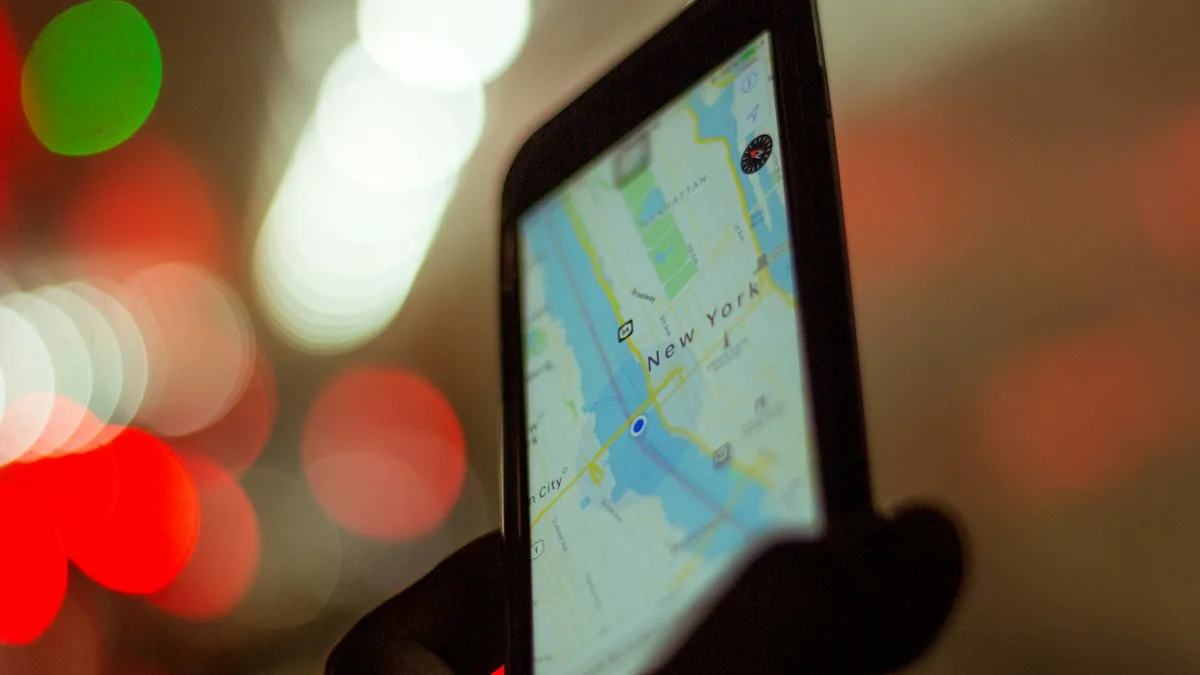 A person holding a smartphone displaying GPS